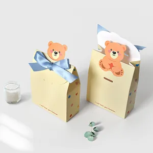 Charming yellow folding gift boxes with cartoon bears and blue bows for Valentine's Day