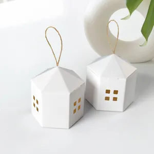 White house-shaped gift boxes with cutout windows and natural hemp rope handles