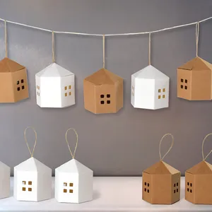 Minimalist house-shaped paper gift boxes with cutout windows and jute rope hangers