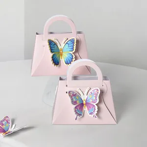 Pink handbag-shaped gift box with 3D butterfly decor for wedding favors and candy