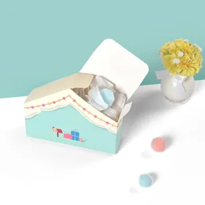 Macaron blue house-shaped gift box with festive illustrations and ribbon details