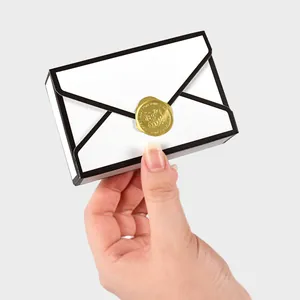 2D style envelope wedding favor box with black trim and gold wax seal decoration
