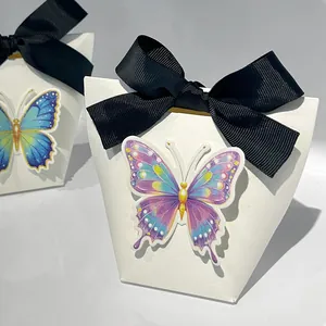 White 3D bow gift box with embossed texture and colorful butterfly decor for favors