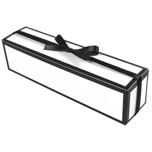 Elegant white rectangular gift box with black ribbon bow for perfumes and luxury items