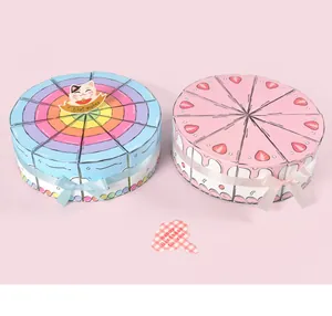 Detail of creative triangle cake-shaped gift boxes with ribbons and birthday cards