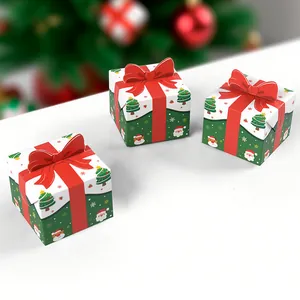 Mini folding Christmas gift boxes with red 3D bows and festive cartoon patterns