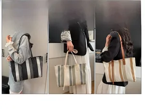 Close-up of three vertical stripe tote bags showing multiple carrying methods in warm indoor