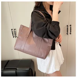 Detailed view of dusty rose faux leather tote bag showing premium matte texture and stitching
