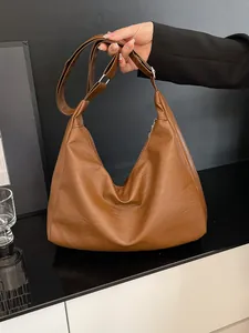 Brown leather Hobo tote bag with chain strap and spacious minimalist design for women