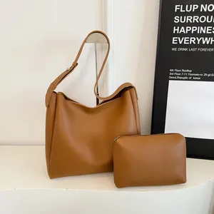 Brown leather tote bag set with matching inner pouch and wide adjustable strap