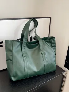 Large dark green tote bag in bark texture PU leather with spacious interior and shoulder straps