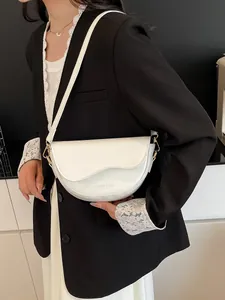 Minimalist white PU leather saddle bag for women with adjustable shoulder strap and gold hardware
