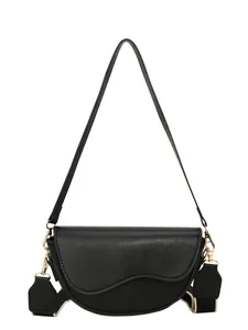 Classic matte black leather saddle bag with wide patterned strap and gold hardware accents