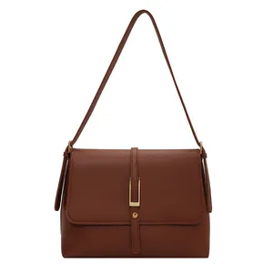 Vintage brown leather shoulder bag with sleek metal buckle and flap design for women