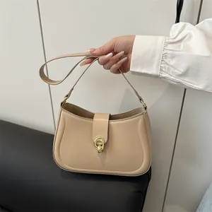 Chic beige shoulder bag with gold metal ring buckle and minimalist arc design for women