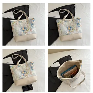Detail view of large tote bag with ink flower print and spacious interior for tablets