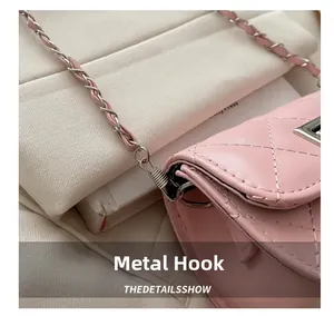Macro detail of high-quality pink leather chain strap and metallic hardware hooks