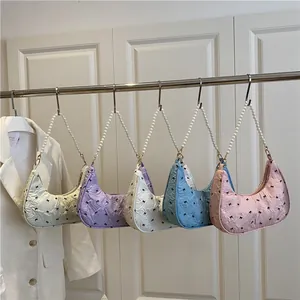 Chic pleated crescent shoulder bag with cute bow pattern and elegant pearl handle
