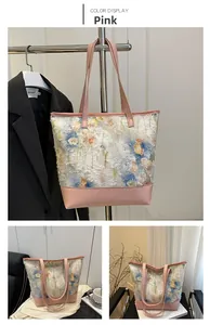 Detail of pink leather trim on tote bag with blue and yellow floral ink patterns