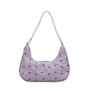Chic light purple hobo bag with bow print, textured fabric and pearl bead handle