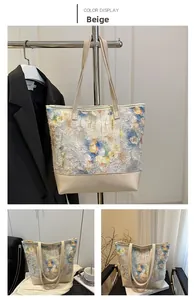 Detail of floral tote bag with beige leather straps and 3D textured ink painting pattern