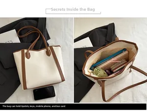 Internal view of large bicolor tote bag showing spacious main compartment for essentials