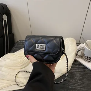 Quilted diamond stitch mini crossbody bag with silver chain strap and metal turn-lock