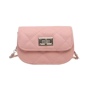 Chic pink quilted mini crossbody bag with silver chain strap and metal turn-lock closure