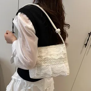 White lace layered bucket bag for women with woven texture and bow shoulder strap