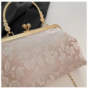 Détails du tissu jacquard floral beige avec cadre doré et poignée en métal sculpté