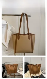 Detailed view of the brown large capacity tote bag with premium lychee grain leather texture