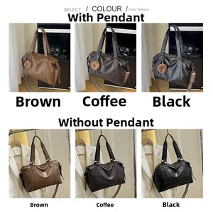 Selection of large capacity shoulder bags in brown and black with optional pendants