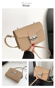 Detailed view of khaki square crossbody bag with metallic silver clasp and textured PU leather