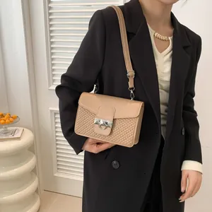 Chic beige embossed crossbody bag with woven texture and gold buckle for women