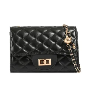 Black quilted flap bag with classic diamond stitch pattern and gold ball chain strap