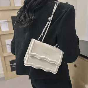 Fashionable beige scalloped flap bag with metal chain strap for women casual commute