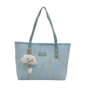 Light blue tote bag with colorful wavy embroidery and white cloud plush pendant charm