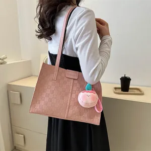 Pink vintage woven tote bag with peach plush pendant and fashion lettering