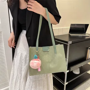 Light green large capacity tote bag with grid texture and pink plush keychain accessory