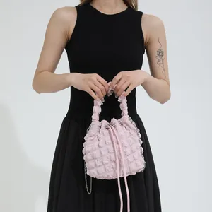 Pink puffy cloud bucket bag with textured fabric and crossbody chain for women
