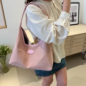 Pink crescent hobo bag for women with minimalist shoulder strap for casual commute
