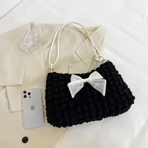 Chic black popcorn cloud shoulder bag with a white bow and sleek rope straps