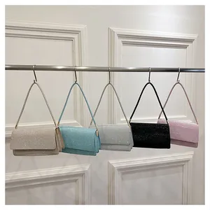 Close-up of sparkling sequin handbags in various trendy colors with sleek metal hardware
