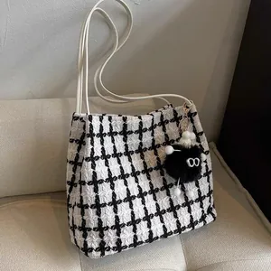 Classic houndstooth tote bag for women with leather straps and plush charm