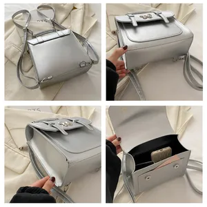 Detail view of silver backpack with butterfly buckle and magnetic closure system