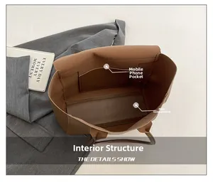Internal structure of the brown leather tote bag with a main pocket and phone slot