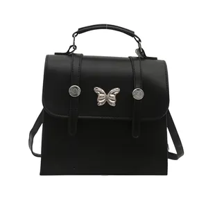 Versatile black PU leather backpack with silver butterfly clasp and top handle for women