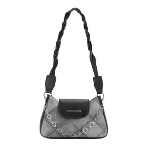 Gray denim underarm bag with black leather flap and silver flower metal chain strap