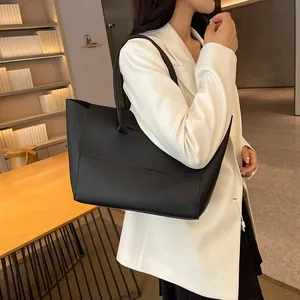 Minimalist black leather tote bag for women with large capacity and shoulder straps