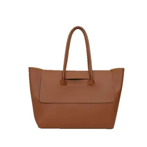 Minimalist brown leather tote bag with flap design and structured top handle for women